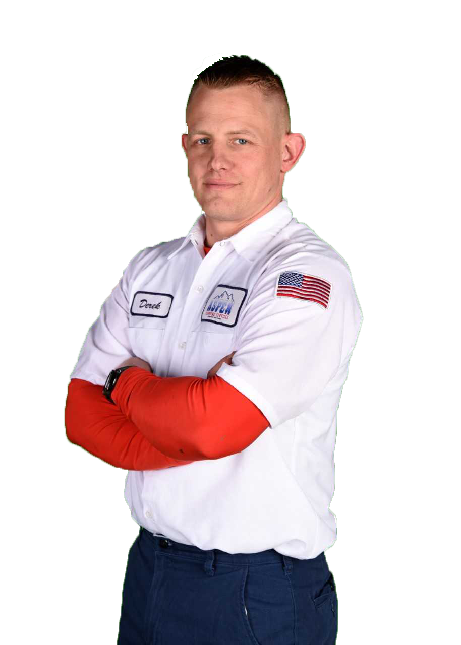 A man with crossed arms wearing a white shirt with a name tag and an American flag patch, representing Jackson Plumbing services.
