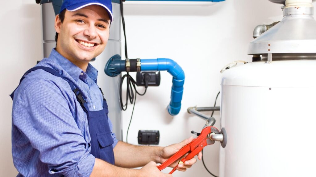 a plumber fixing a water heater