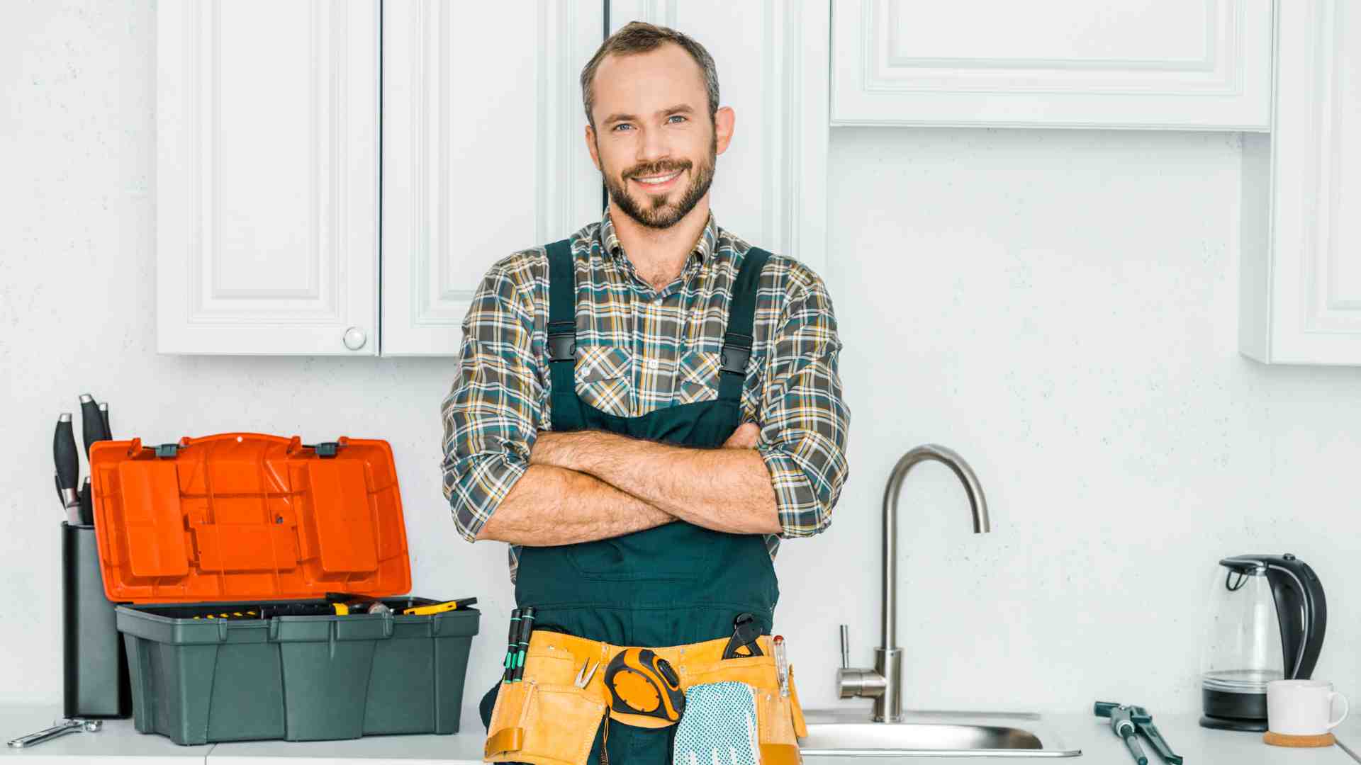 a plumber at the sink